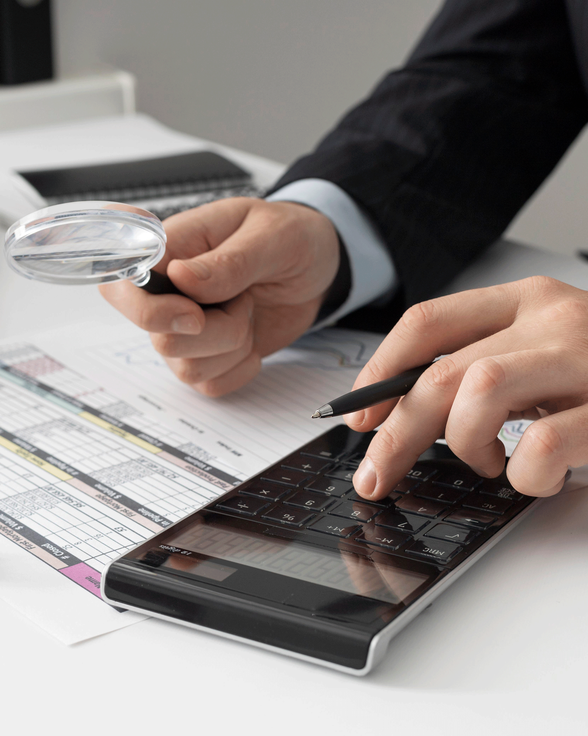 business-man-calculating-finance-numbers-1