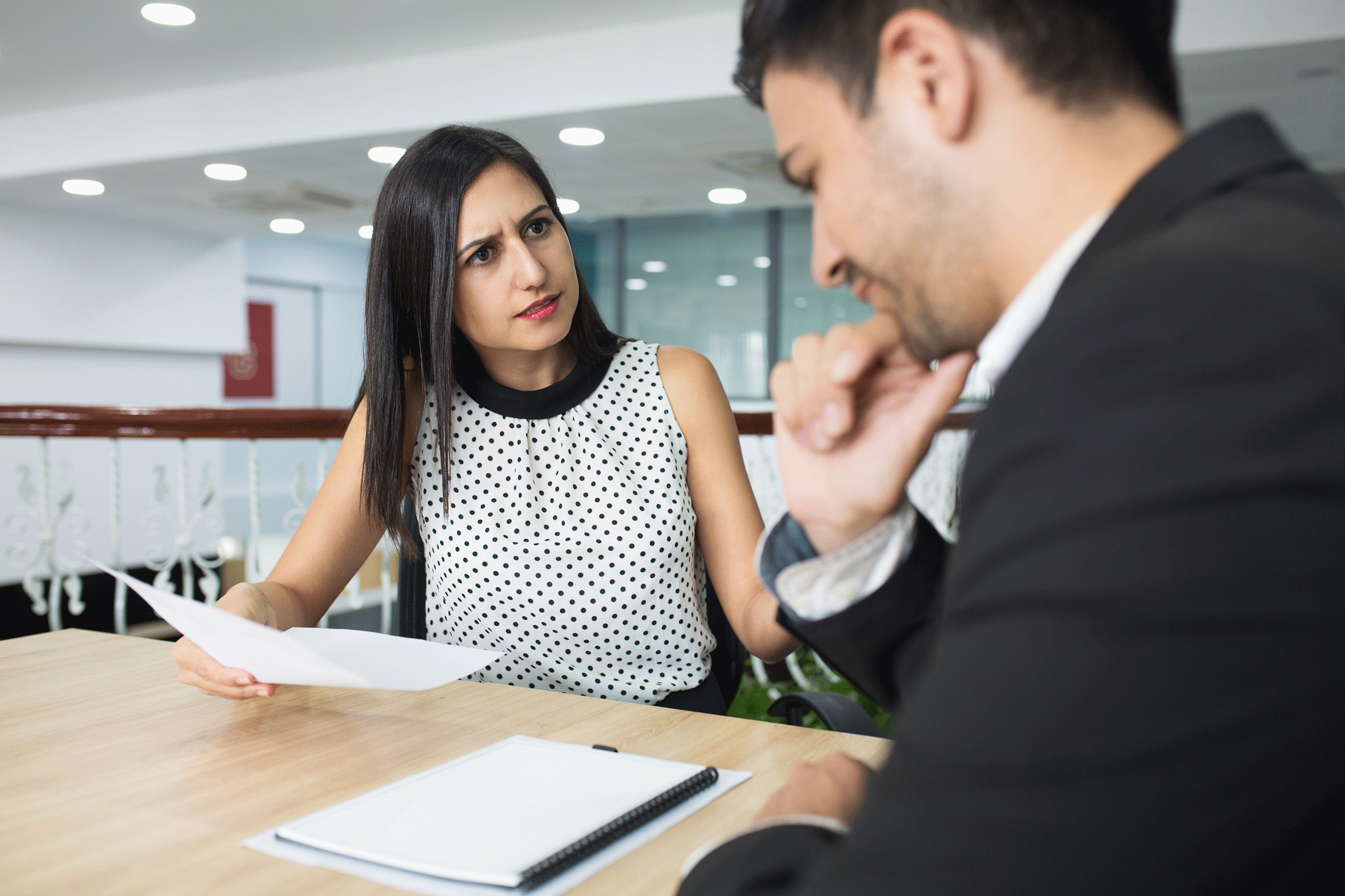 upset-business-lady-dressing-down-employee-mistakes-1