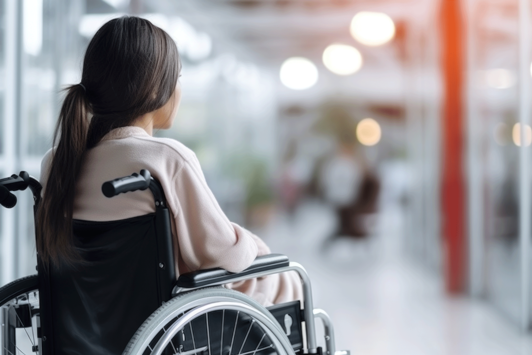 woman-wheelchair-looking-out-window